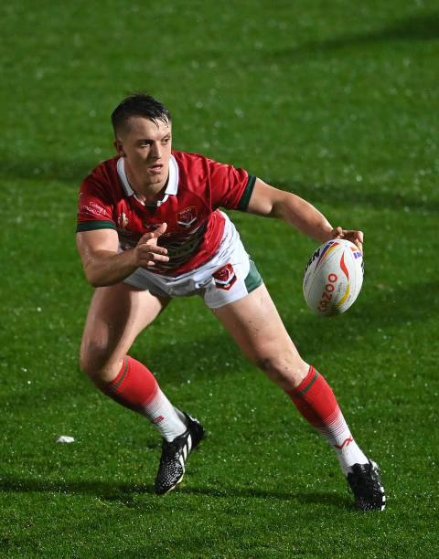 DONCASTER, ENGLAND - OCTOBER 31: Ollie Olds of Wales looks for a pass during the Rugby League World Cup 2021 Pool D match between Papua New Guinea and Wales at the Keepmoat Stadium on October 31, 2022 in Doncaster, England. (Photo by Gareth Copley/Getty Images)